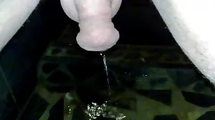 MILF takes a shower and pees on her body in this homemade video