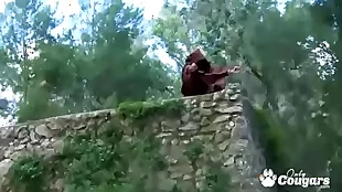 A mature woman gives a blowjob to a monk