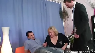 Two guys pleasure busty mature woman in threesome